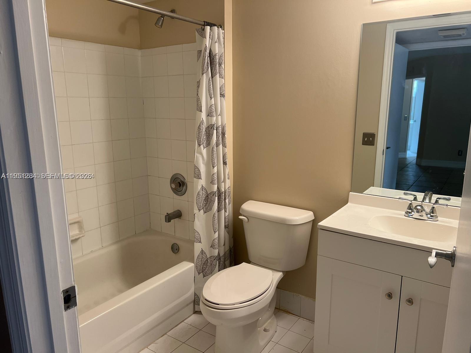 430 South Park Road, Unit 3303 Hollywood, FL 33021 - Photo 7 of 12 a bathroom with a sink toilet and shower