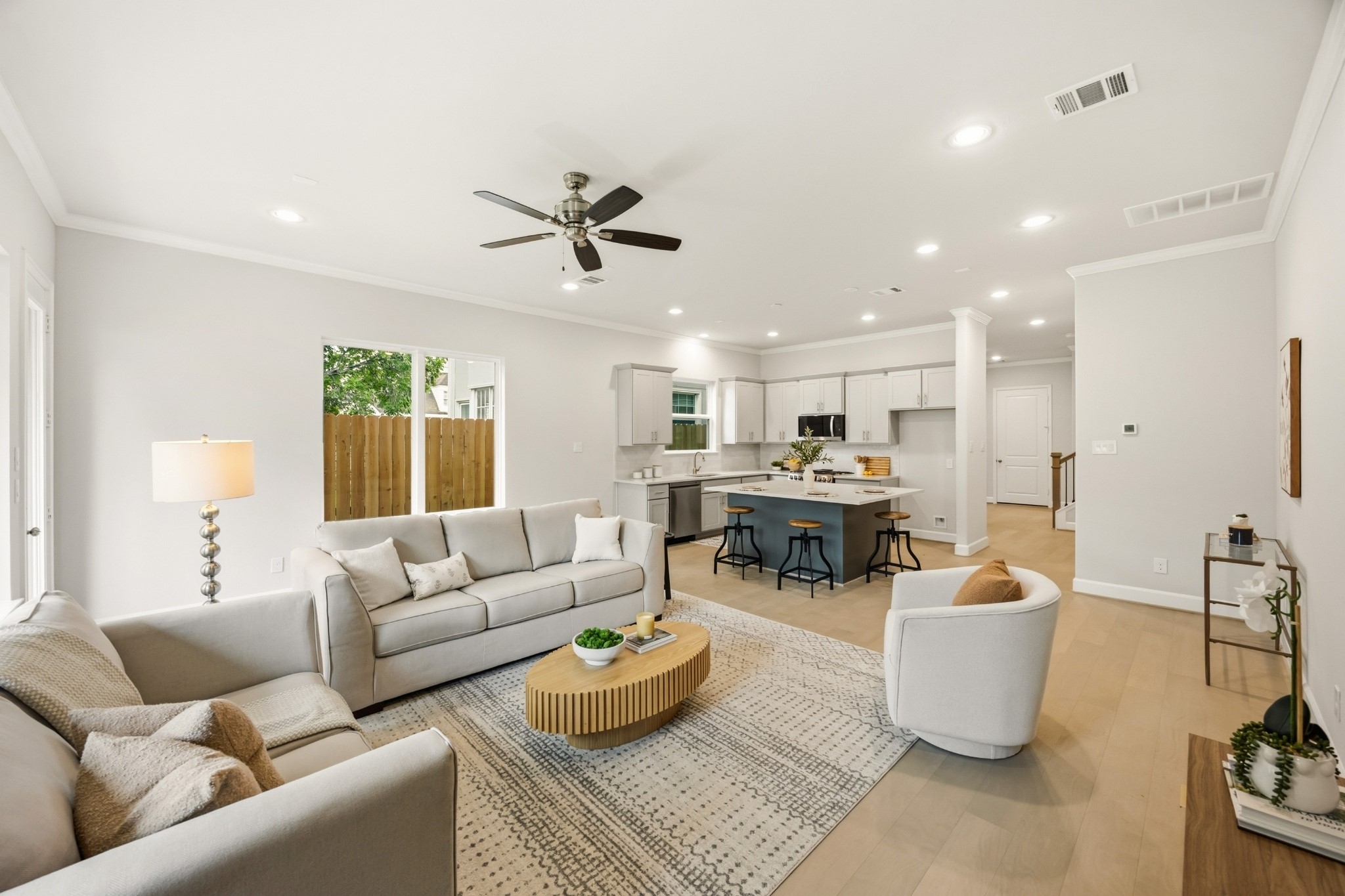 4317 Roseland Street, Unit B Houston, TX 77006 - Photo 7 of 29 The kitchen's open design seamlessly transitions into the spacious living room, affirming the beauty of an interconnected living space.