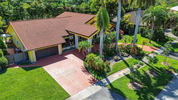 a aerial view of a house with garden and plants