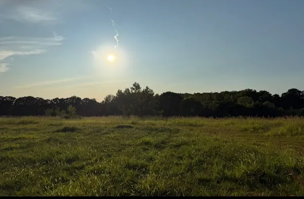a view of an ocean and a mountain