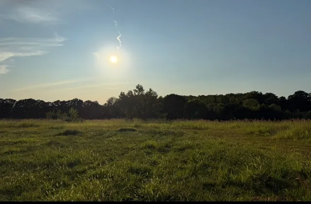 a view of an ocean and a mountain