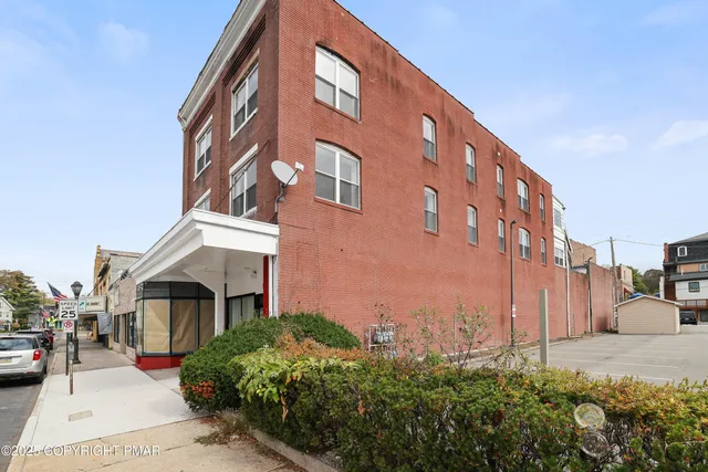 a view of a building with a street