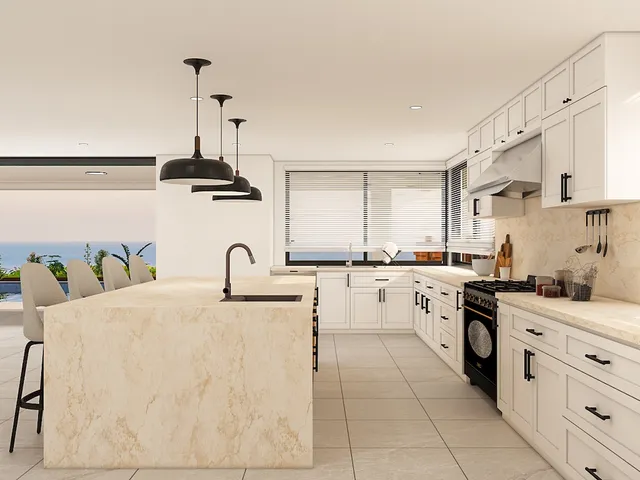 a kitchen with granite countertop a white cabinets and appliances