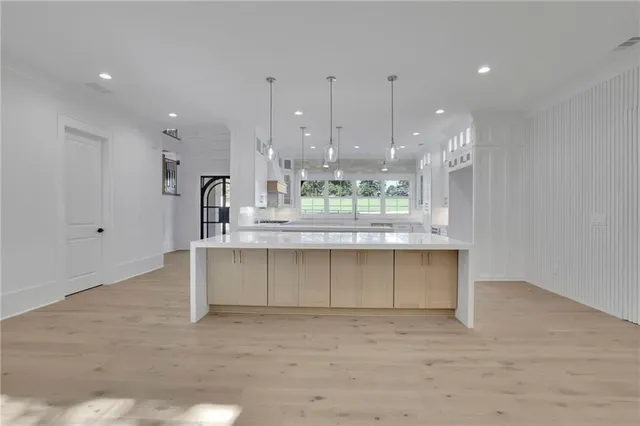 a white bath tub sitting next to a shower