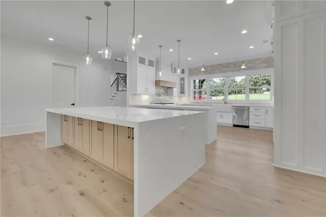 a spacious bathroom with a double vanity sink mirror and