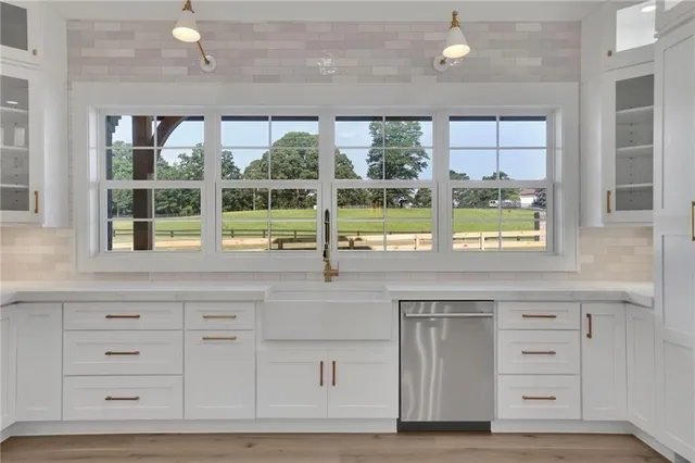 a view of an empty room with windows