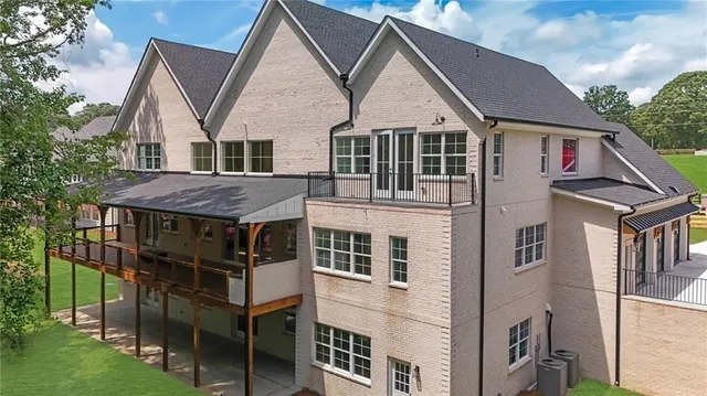 a kitchen with stainless steel appliances white cabinets and wooden floor