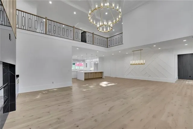 a kitchen with stainless steel appliances cabinets and wooden floor