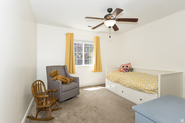 7797 North Windhover Road Eagle Mountain, UT 84005 - Photo 21 of 33 Carpeted room featuring a ceiling fan with integrated lighting, a window with exterior scenery, and white wall finishes