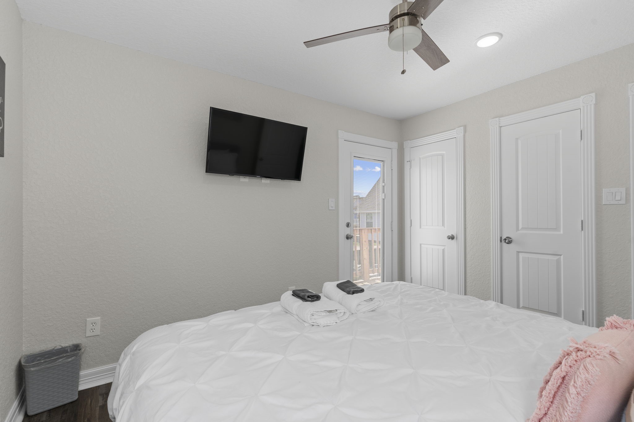 203 Sandpebble Place Surfside Beach, TX 77541 - Photo 19 of 27 a bedroom with a bed and a flat screen tv