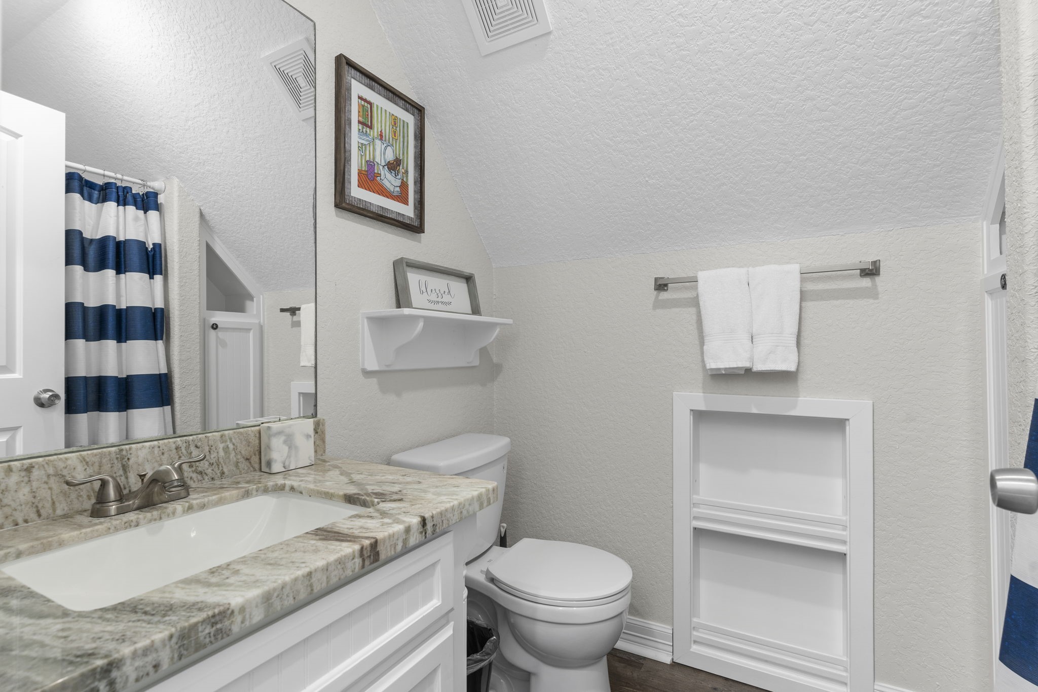 203 Sandpebble Place Surfside Beach, TX 77541 - Photo 23 of 27 a bathroom with a granite countertop sink and a toilet