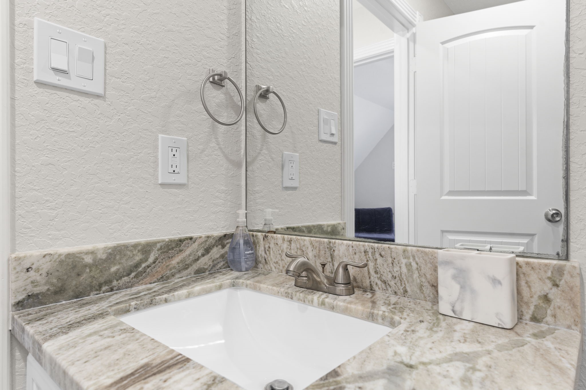 203 Sandpebble Place Surfside Beach, TX 77541 - Photo 25 of 27 a bathroom with a bathtub and a sink