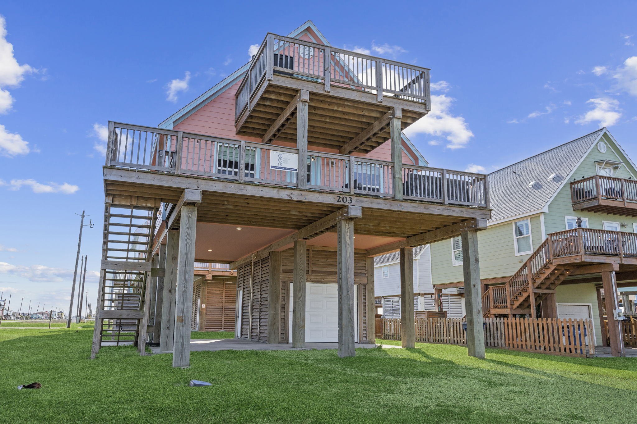 203 Sandpebble Place Surfside Beach, TX 77541 - Photo 6 of 27 a view of a house with a yard