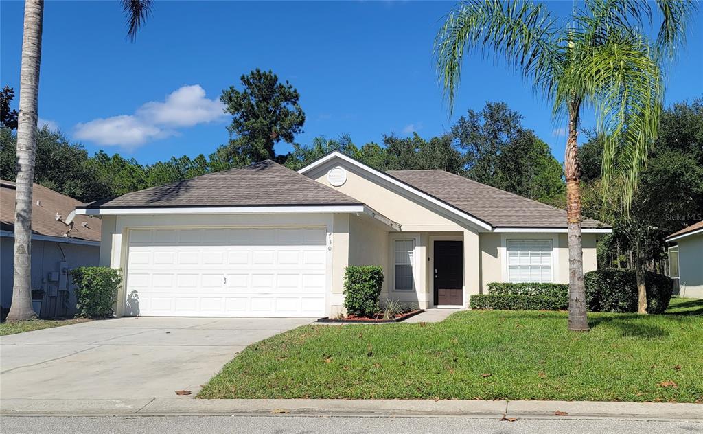 730 Pine Cone Drive Davenport, FL 33897 - Photo 1 of 15 a view of a house with a yard