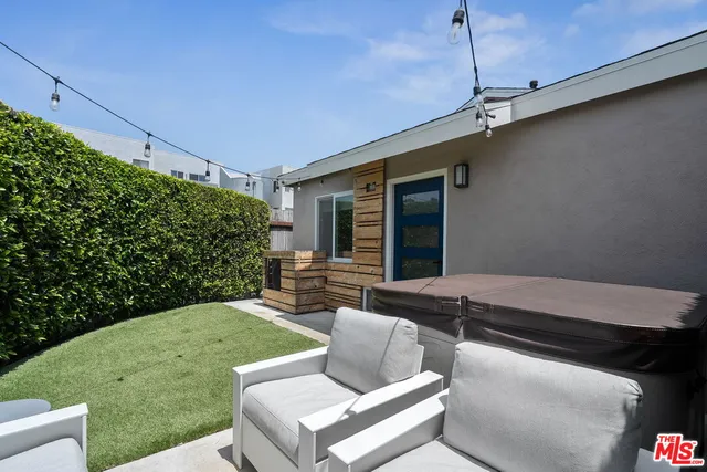 a backyard of a house with seating space