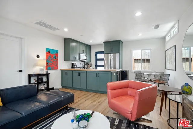 a large kitchen with lots of counter space and windows