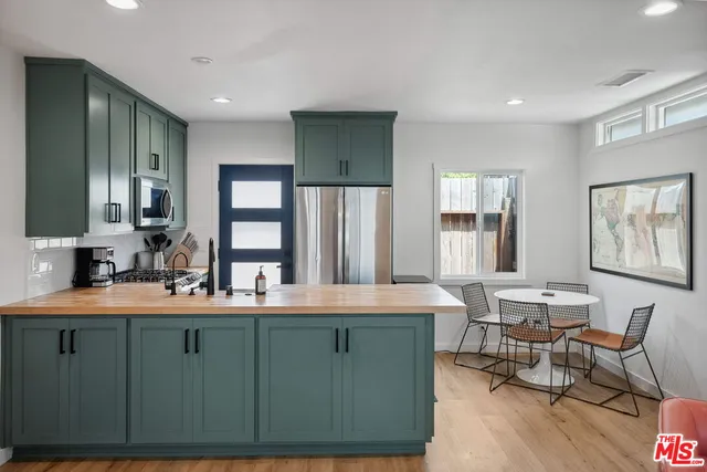 a view of a dining room with furniture and window
