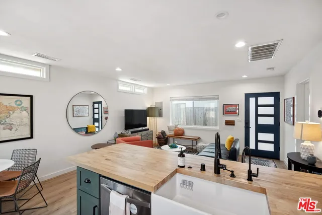 a bathroom with a sink mirror and toilet