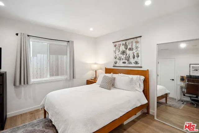 a bathroom with a sink a mirror and a shower