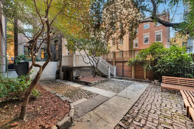 a view of a hallway view with wooden floor and staircase