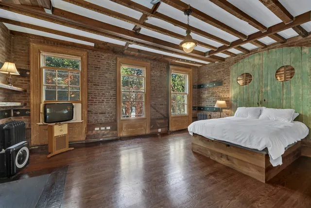 a view of a livingroom with wooden floor