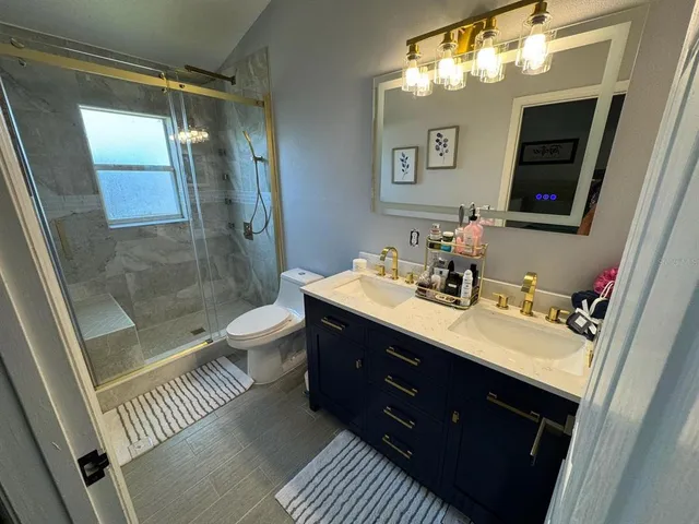 an empty room with a ceiling fan and window