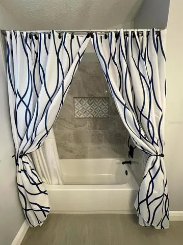 a view of a house with a yard porch and a table