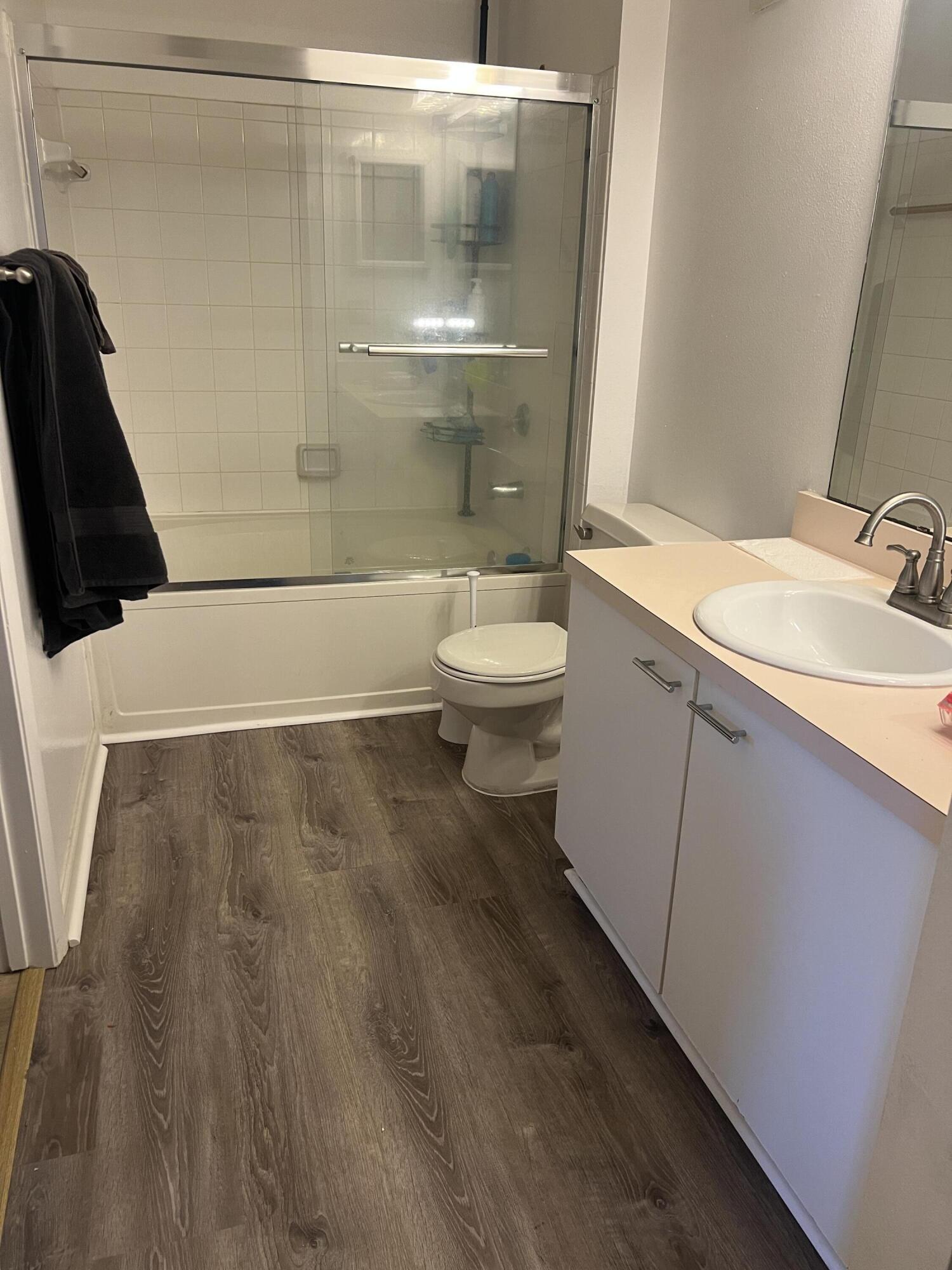 4879 Via Palm Lakes, Unit 619 West Palm Beach, FL 33417 - Photo 10 of 19 Bathroom with new laminate floor