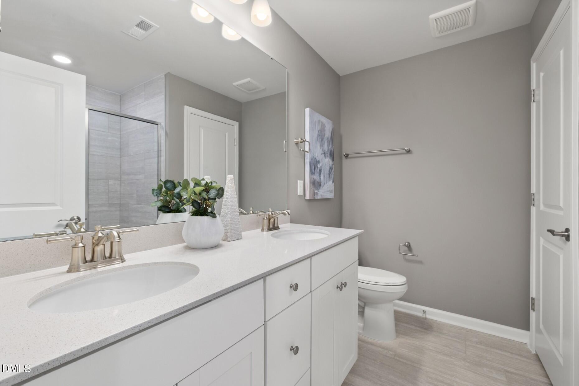 2913 Denson Road Fuquay-Varina, NC 27526 - Photo 12 of 30 a bathroom with a sink toilet and shower