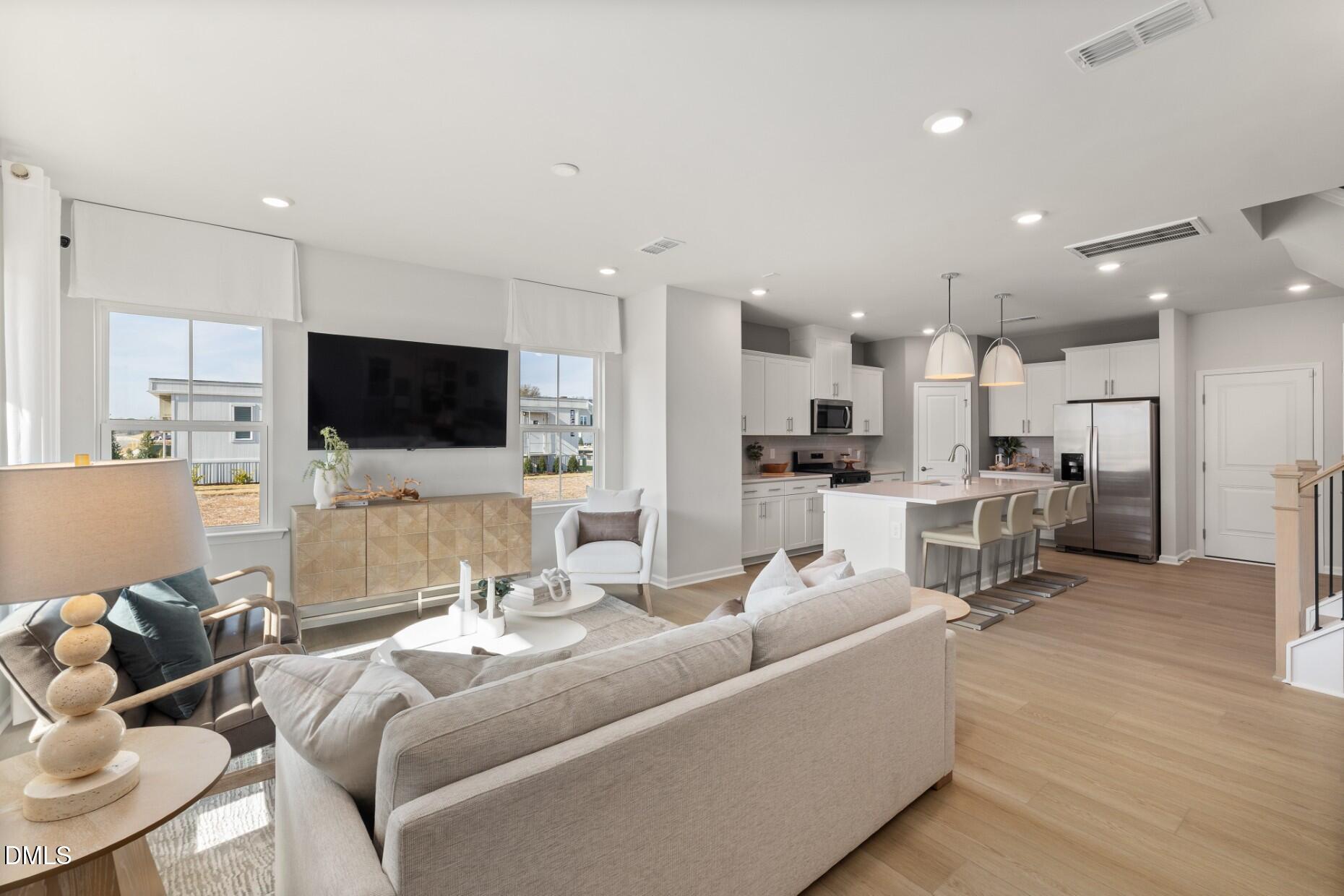 2913 Denson Road Fuquay-Varina, NC 27526 - Photo 7 of 30 a living room with furniture and a flat screen tv