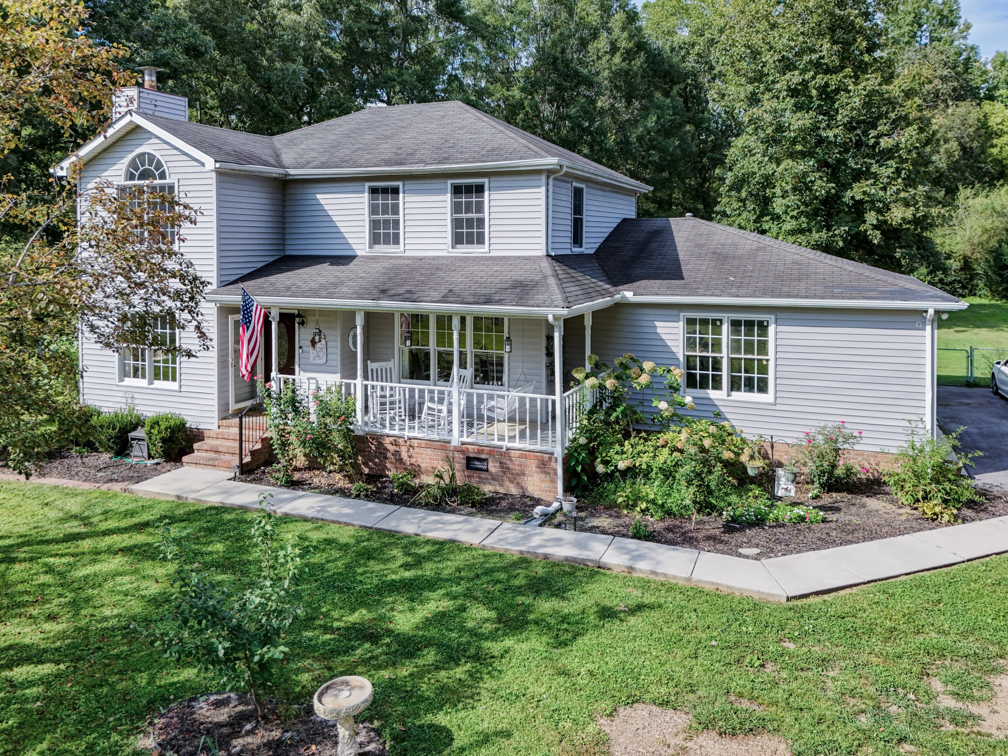 88 Chapel Road Tullahoma, TN 37388 - Photo 24 of 27 a front view of a house with a garden and plants