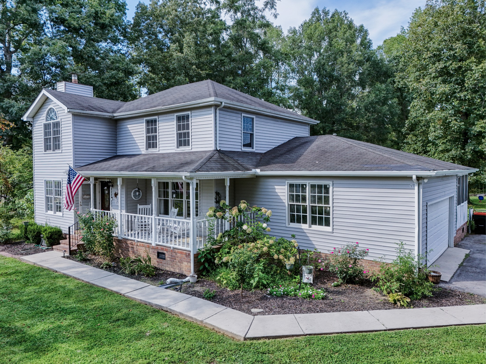 88 Chapel Road Tullahoma, TN 37388 - Photo 26 of 27 a front view of a house with a yard and potted plants