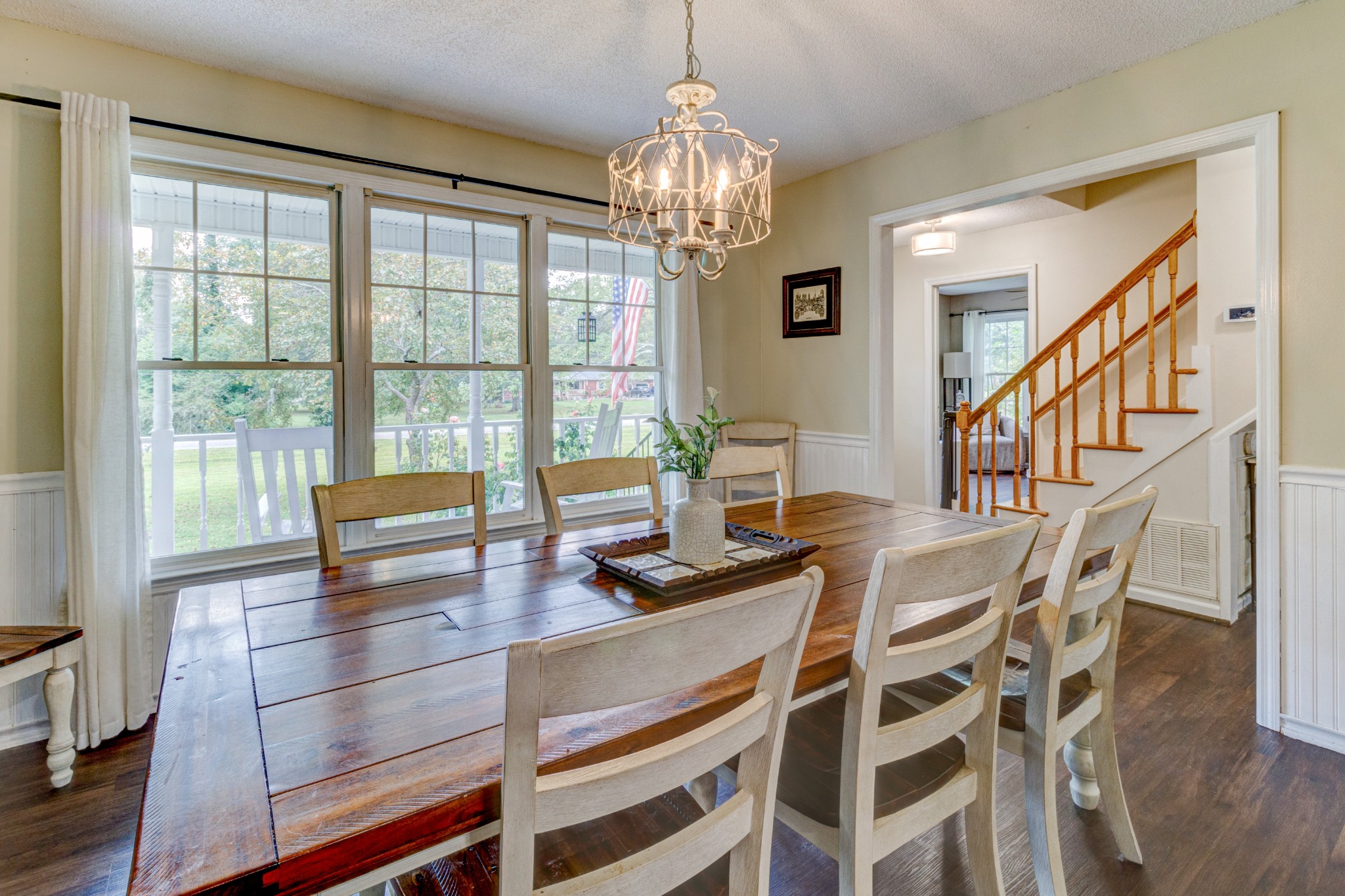 88 Chapel Road Tullahoma, TN 37388 - Photo 5 of 27 a dining room with furniture a chandelier and wooden floor