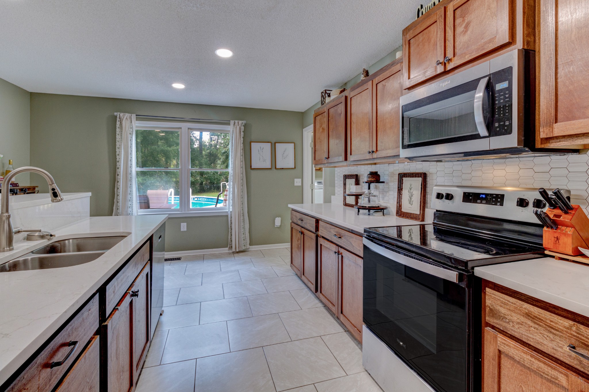 88 Chapel Road Tullahoma, TN 37388 - Photo 10 of 27 a kitchen with stainless steel appliances granite countertop a sink and a stove