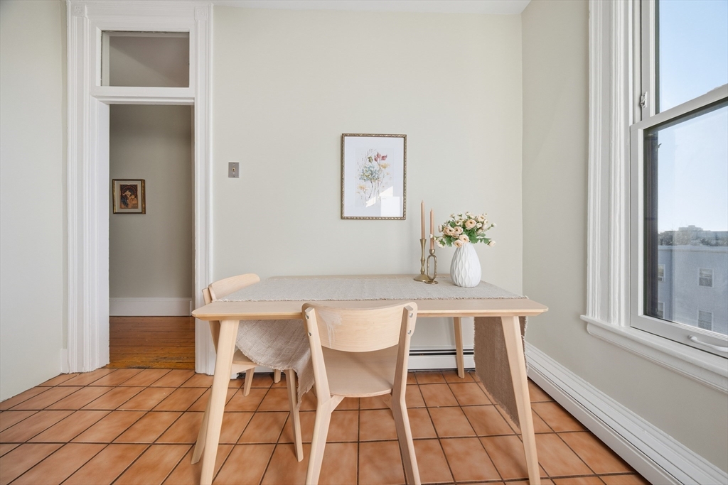 367 Somerville Avenue, Unit G Somerville, MA 02143 - Photo 17 of 39 a view of a dining room with furniture and window