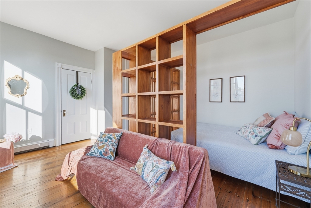 367 Somerville Avenue, Unit G Somerville, MA 02143 - Photo 6 of 39 a living room with furniture and a window