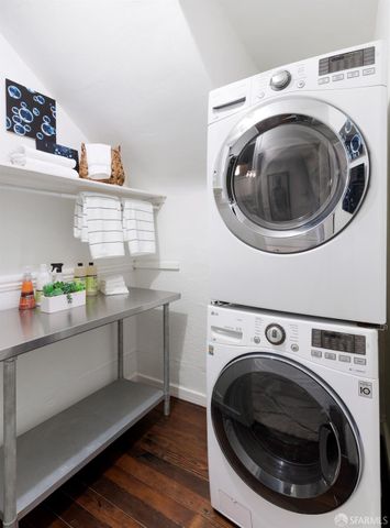 a utility room with sink dryer and washer