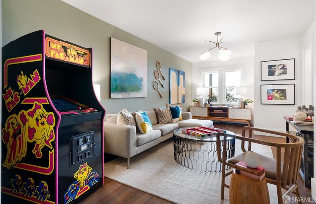a living room with fireplace furniture and a flat screen tv