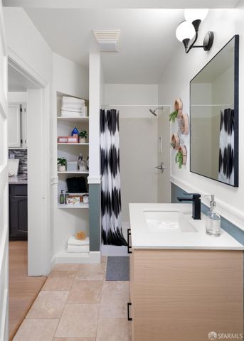 a kitchen with refrigerator and car