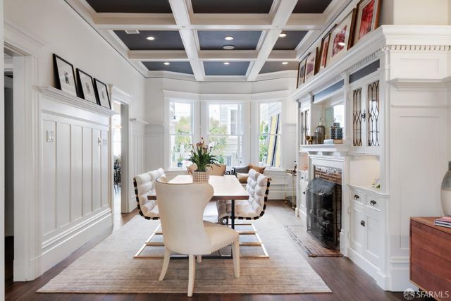 a dining room with furniture and entryway