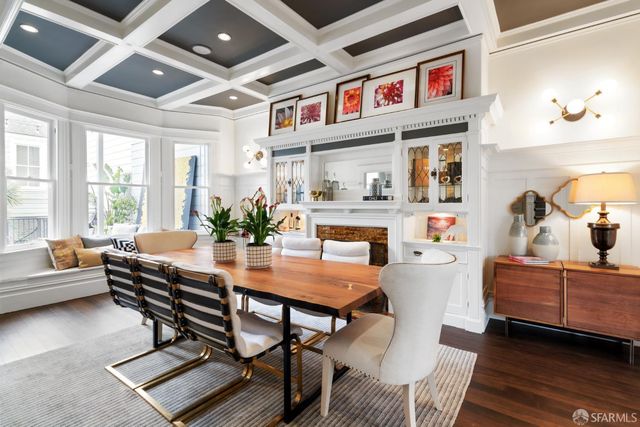 a dining room with furniture and window