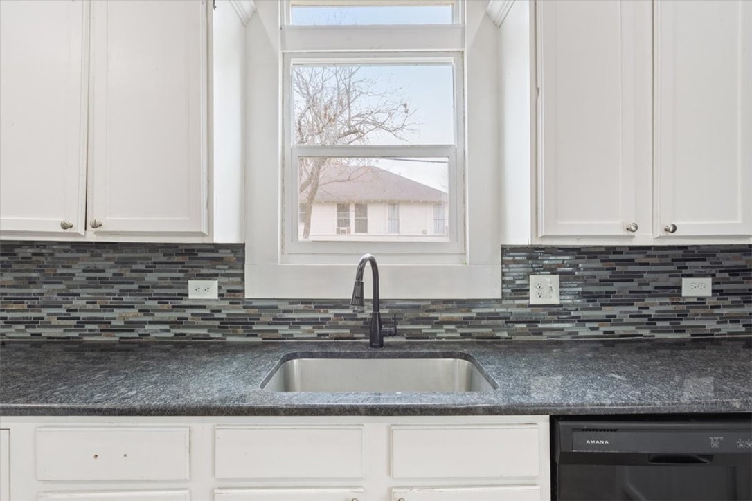 2000 Bosque Boulevard Waco, TX 76707 - Photo 13 of 51 a kitchen with granite countertop white cabinets and a sink