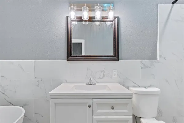 a bathroom with a sink and a toilet