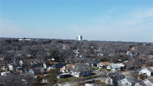 a aerial view of a house with a yard