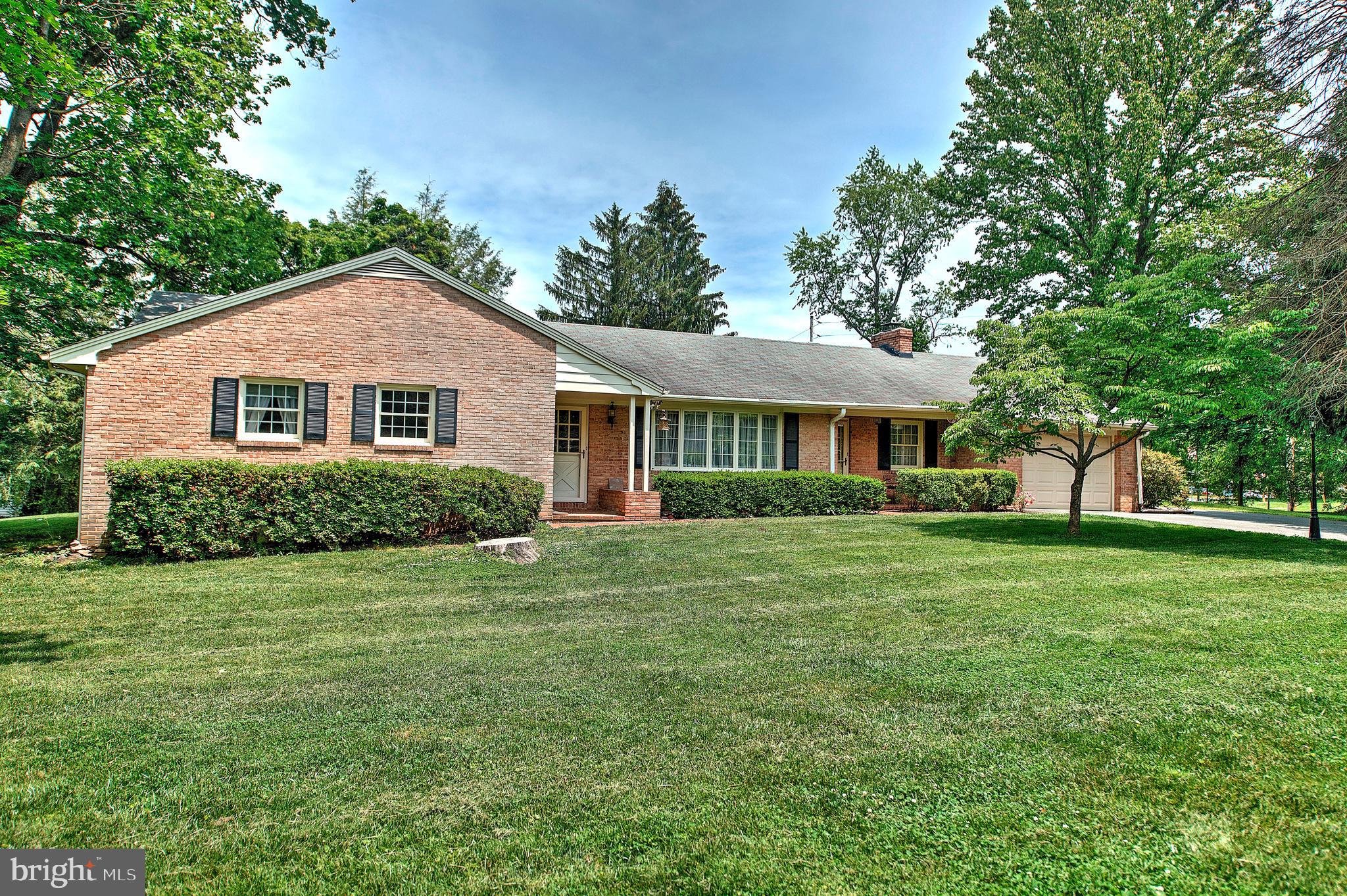 1303 Old Fallston Road Fallston, MD 21047 - Photo 2 of 65 a front view of a house with a garden