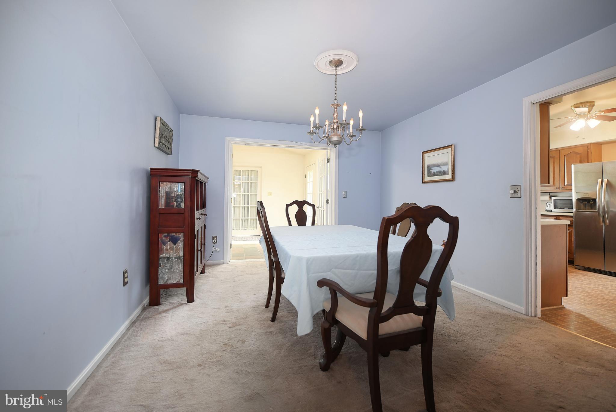 1303 Old Fallston Road Fallston, MD 21047 - Photo 21 of 65 a view of a dining room with furniture and chandelier