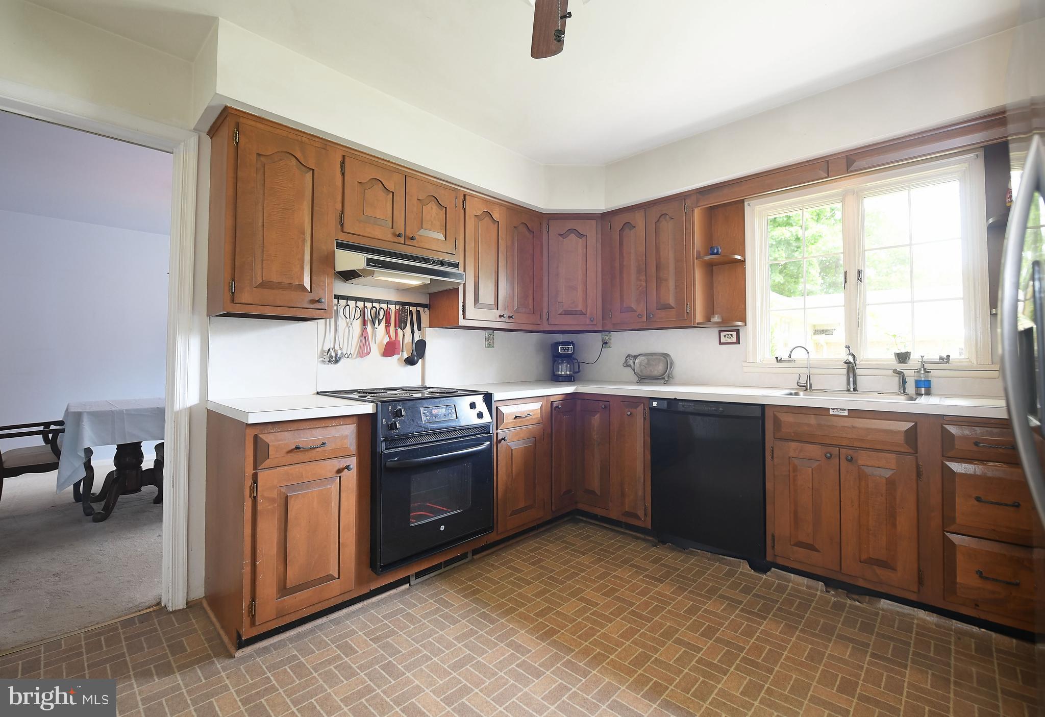 1303 Old Fallston Road Fallston, MD 21047 - Photo 23 of 65 a kitchen with stainless steel appliances granite countertop a stove sink and cabinets