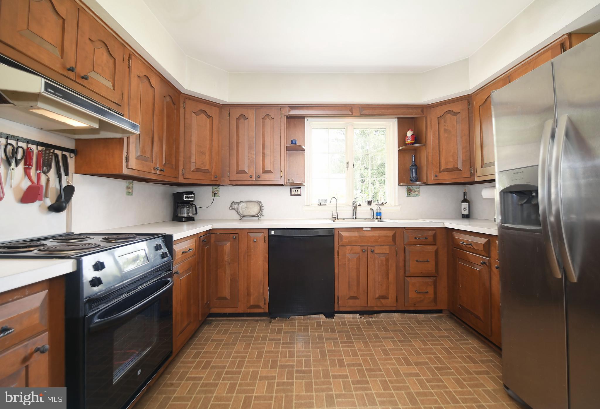 1303 Old Fallston Road Fallston, MD 21047 - Photo 24 of 65 a kitchen with stainless steel appliances granite countertop a stove a sink dishwasher and a refrigerator