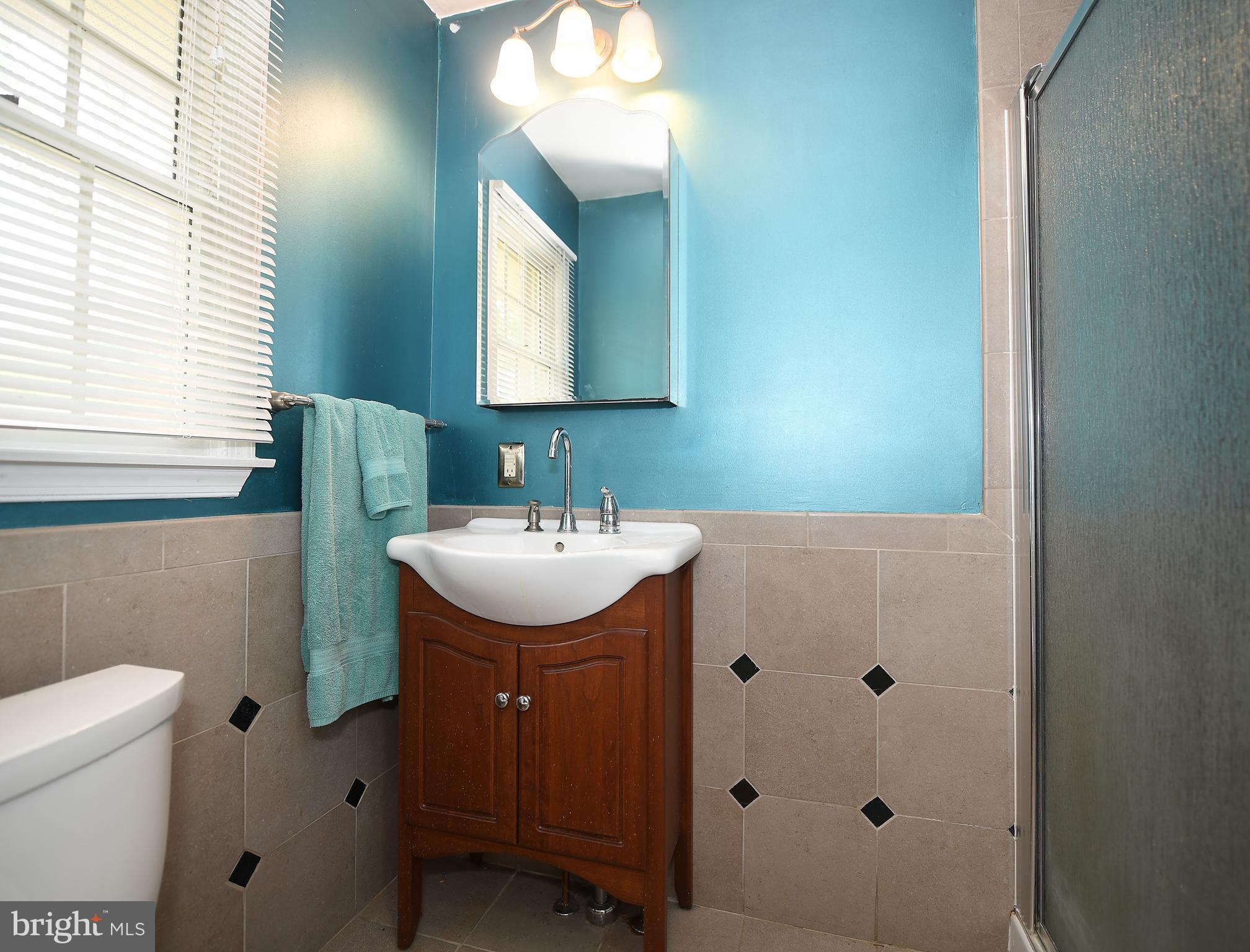 1303 Old Fallston Road Fallston, MD 21047 - Photo 30 of 65 a bathroom with a sink toilet and mirror