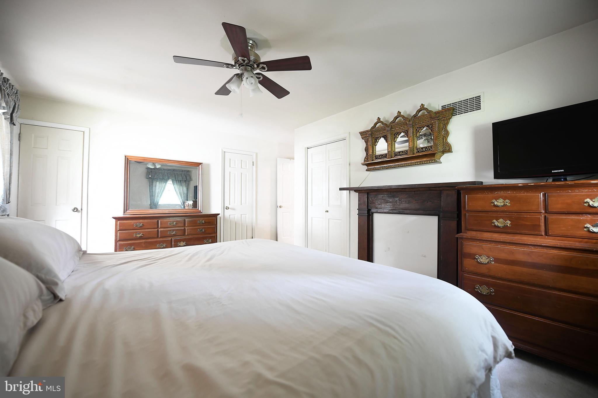 1303 Old Fallston Road Fallston, MD 21047 - Photo 32 of 65 a bedroom with a bed and a television